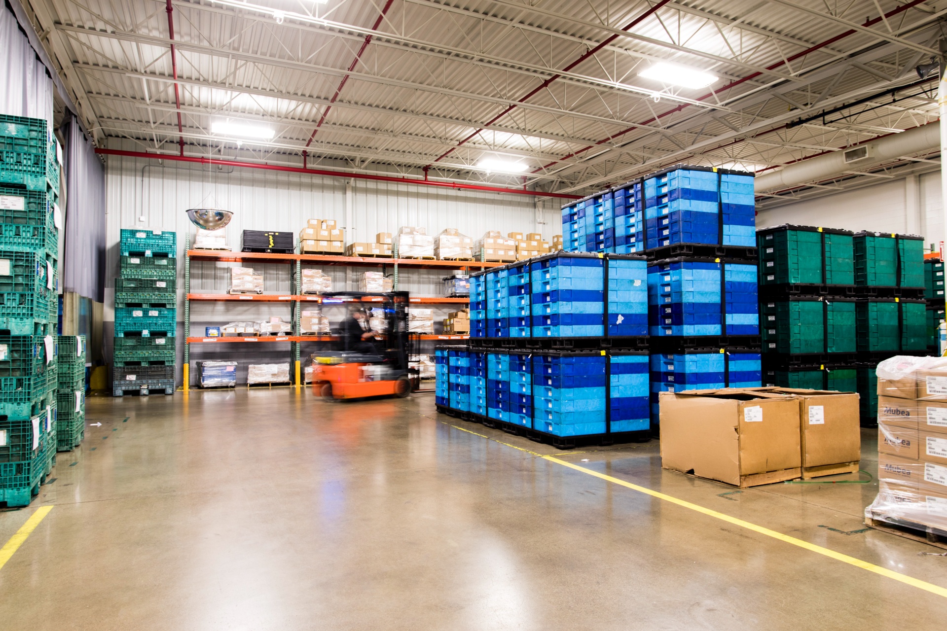 Forklift lifting product at AAM after construction