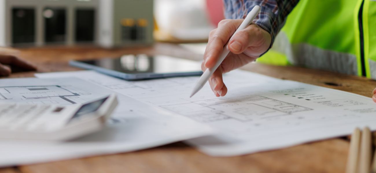 Construction Manager Looking Over Blueprints